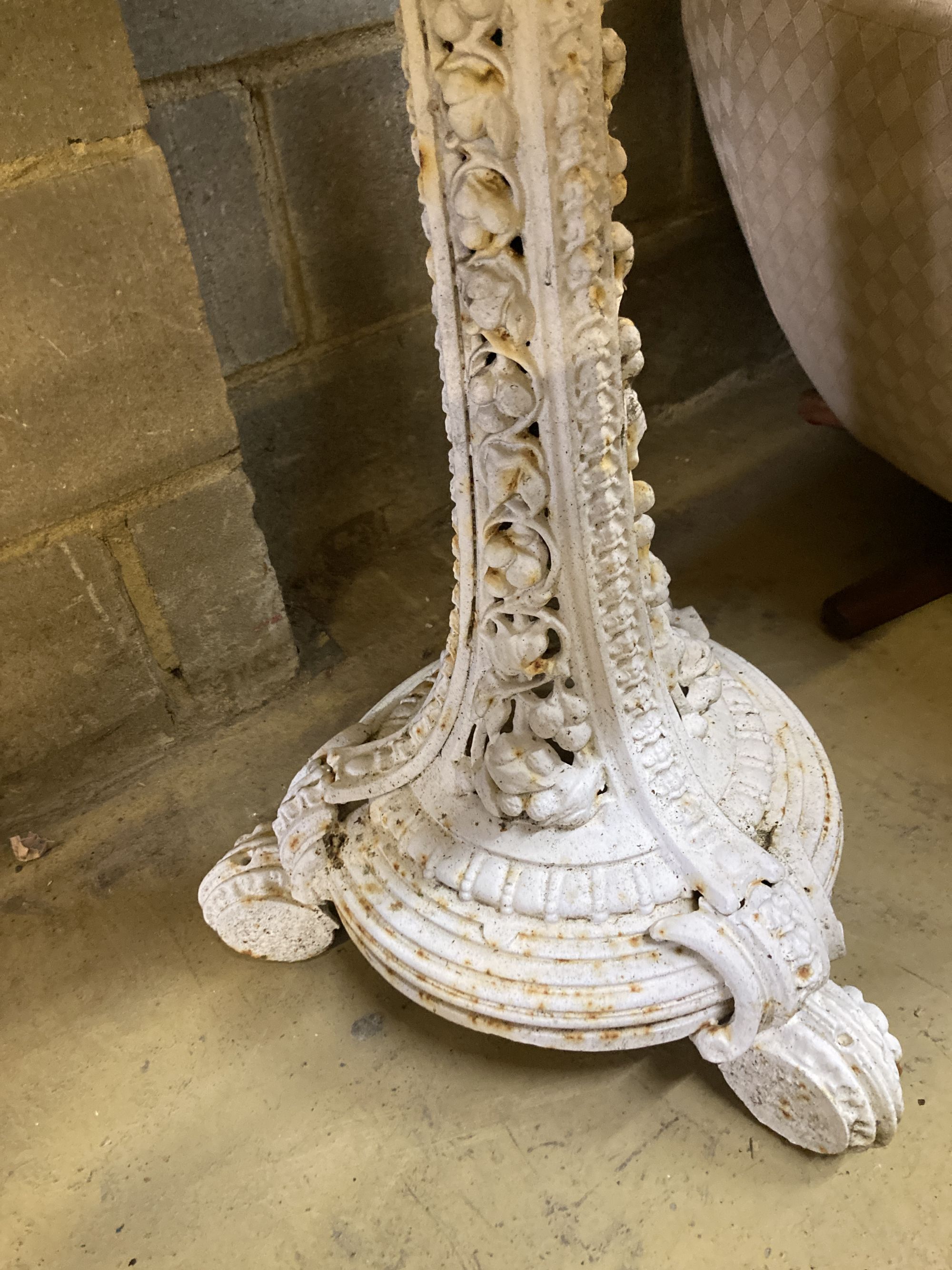 A Coalbrookdale white painted cast iron wine table with later white marble top, 66cm diameter, height 77cm